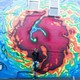 Mathematics, the creator of the iconic Wu-Tang Clan logo, stands before the mural.